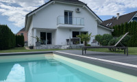 Haus - 2473, Potzneusiedl - Luxuriöses Wohnen: Designhaus mit Garten, Pool und geräumiger Garage