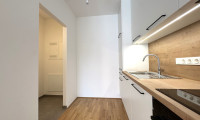 Wohnung - 2700, Wiener Neustadt - SCHULGARTENGASSE | Erstbezug - Gut geschnittene 2 Zimmer Wohnung | Loggia | Einbauküche | Elektr. Beschattung | Optional: Tiefgaragenstellplatz